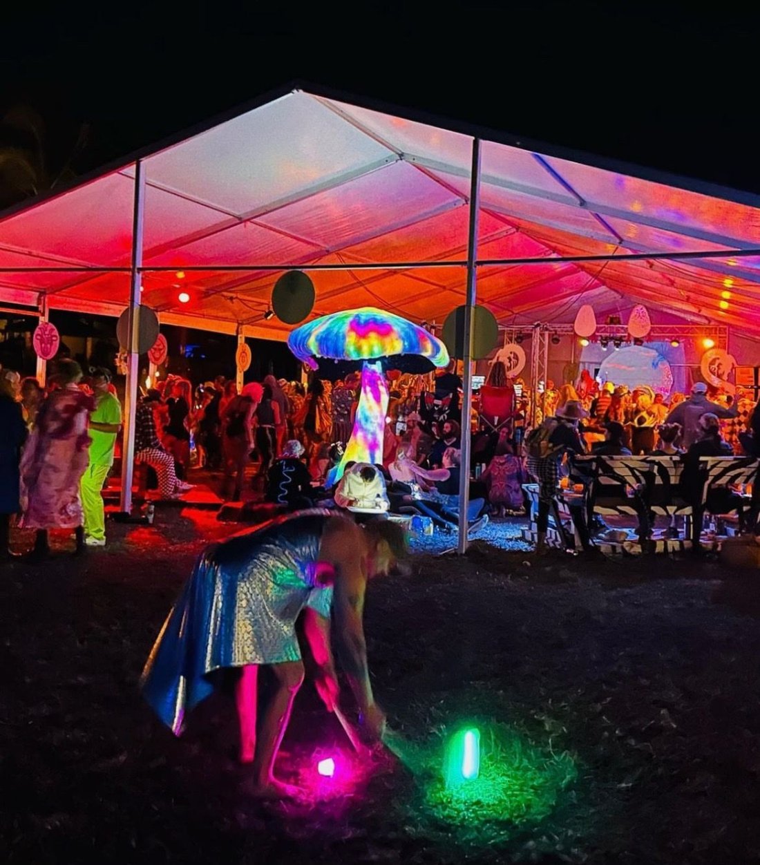Giant LED mushroom sculpture glowing over a festival crowd on the Big Island of Hawaii